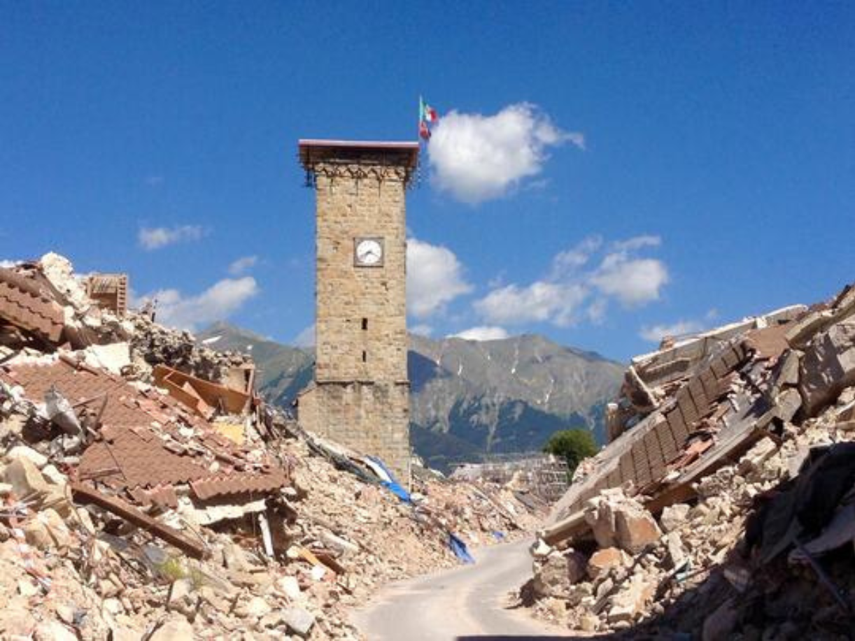 clock tower surrounded by earthquake rubble in Amatrice 