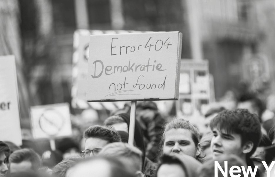 Sign reading "Error 404 Demokratie not found"