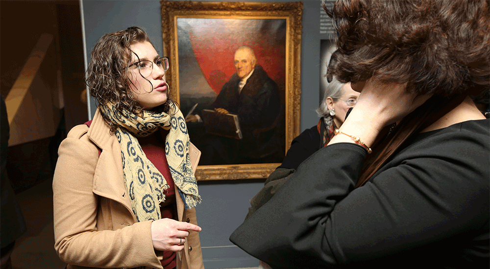 Guests talking in front of the Da Ponte portrait in the Casa Italiana Exhibition Space.