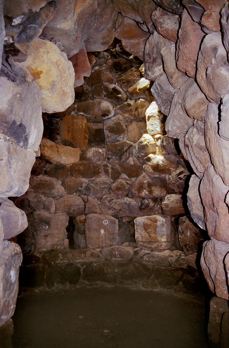 Interior corbelled tower through doorway 